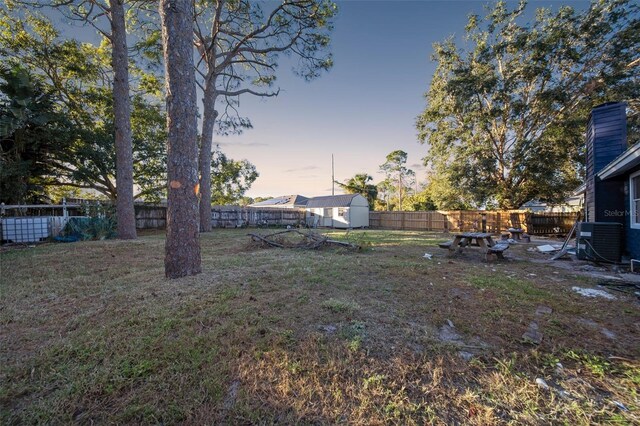 896 Talmadge Ave SE, Palm Bay, FL 32909 - yard at dusk featuring cooling unit