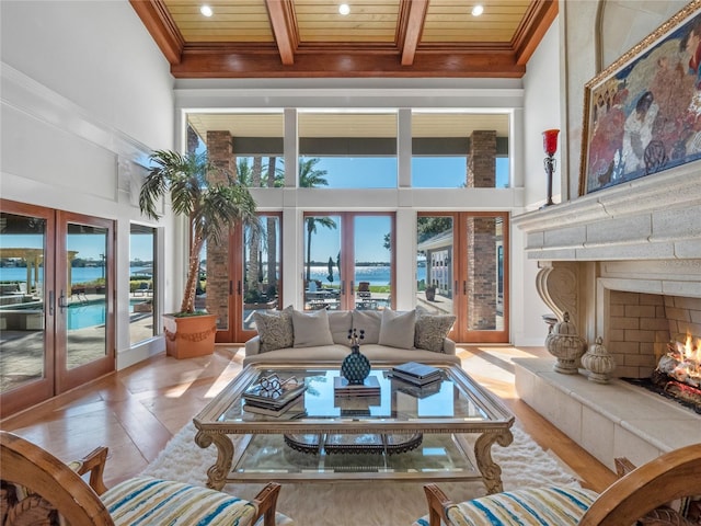 sunroom / solarium with beam ceiling, french doors, and wood ceiling