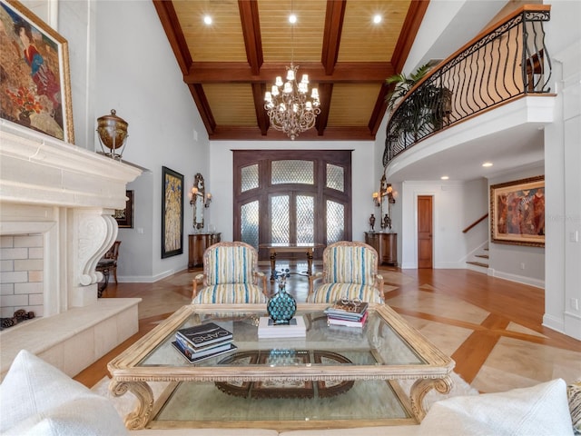 interior space featuring wood ceiling, high vaulted ceiling, and an inviting chandelier