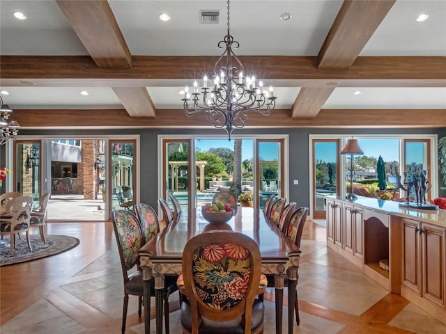 dining area featuring beam ceiling, light tile patterned floors, and a chandelier