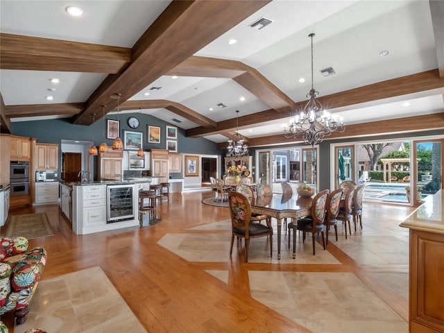 dining room with vaulted ceiling with beams, a chandelier, wine cooler, and light hardwood / wood-style flooring