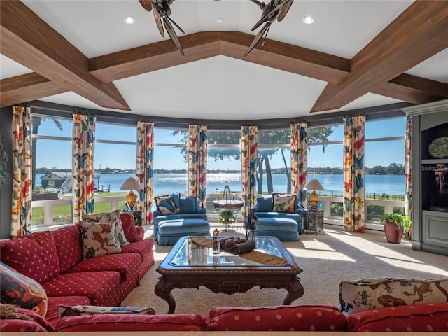 living room featuring carpet, vaulted ceiling with beams, and a water view