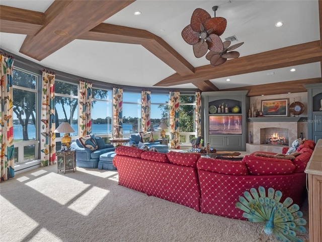 living room featuring carpet, ceiling fan, and beam ceiling