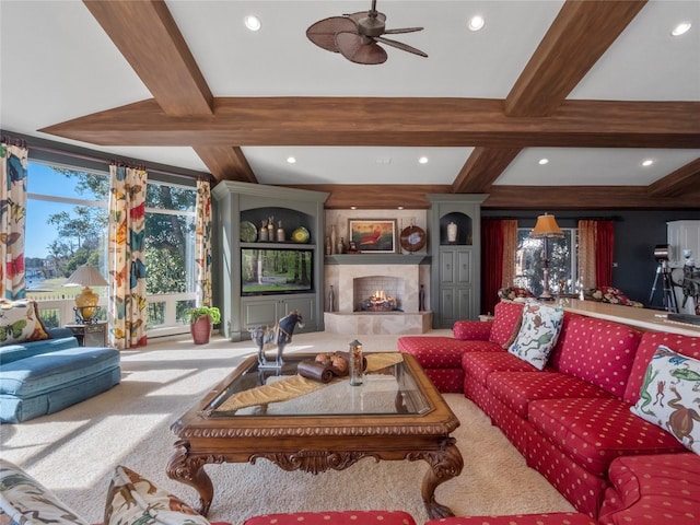 living room with beamed ceiling, ceiling fan, carpet floors, and coffered ceiling