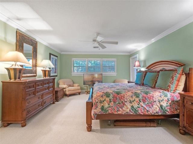 bedroom featuring ceiling fan, light colored carpet, and crown molding