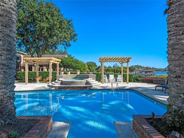 view of pool featuring an in ground hot tub, a pergola, and a patio area