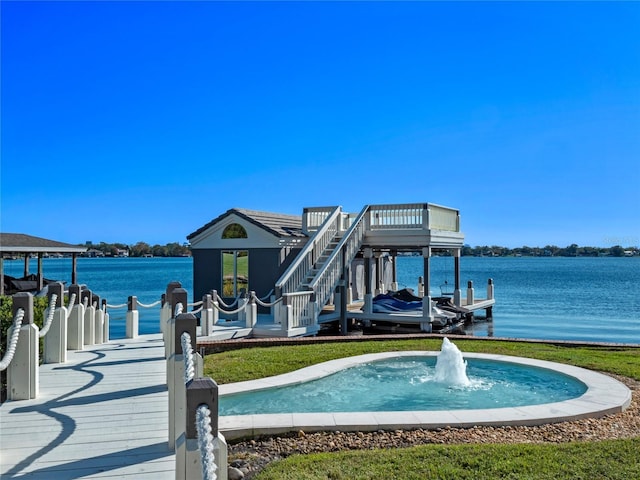 dock area with a water view