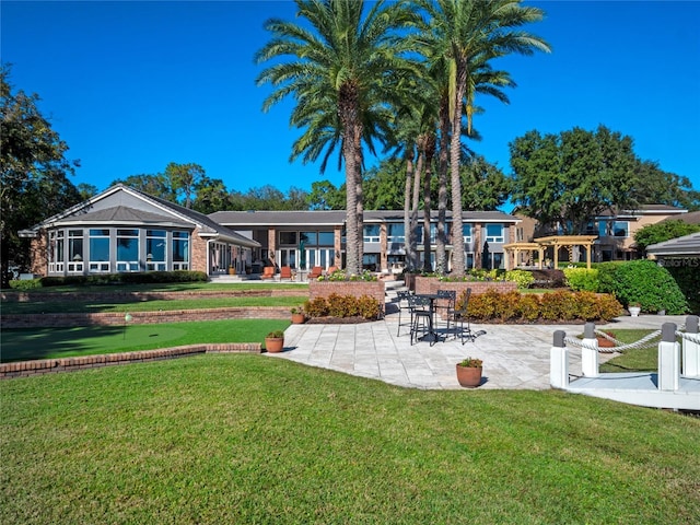 exterior space with a patio area and a lawn