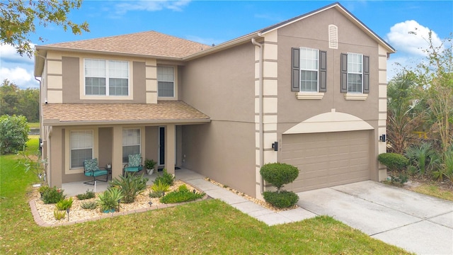 view of front property with a garage and a front lawn