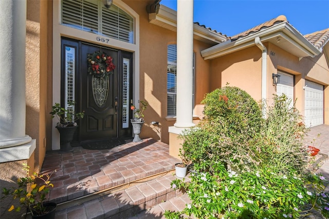 property entrance with a garage