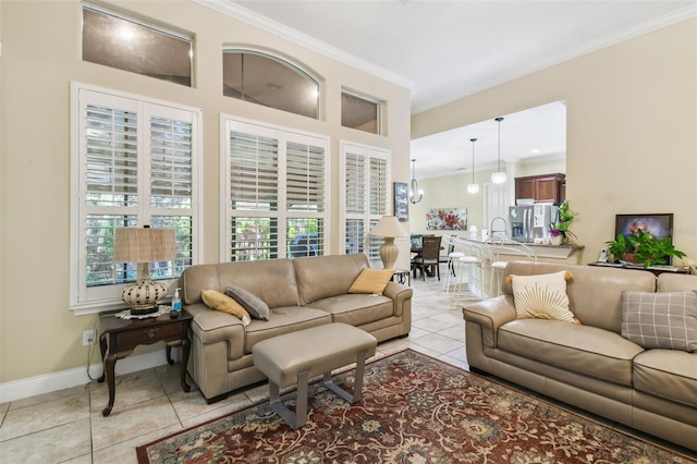 tiled living room with ornamental molding and sink