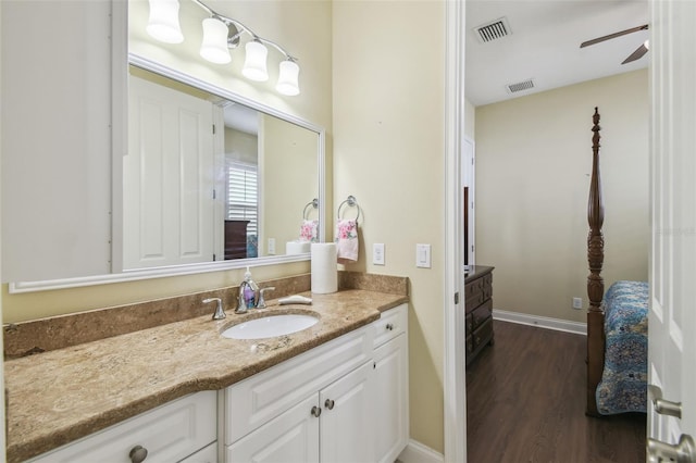 bathroom featuring ceiling fan, vanity, and hardwood / wood-style flooring