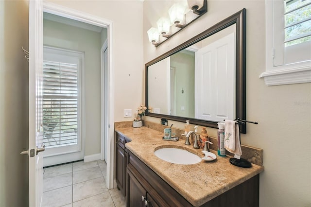 bathroom featuring vanity, tile patterned floors, and a wealth of natural light