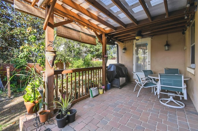 view of patio / terrace featuring a pergola, grilling area, and ceiling fan