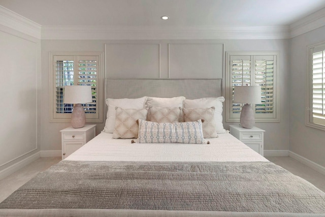 carpeted bedroom featuring crown molding