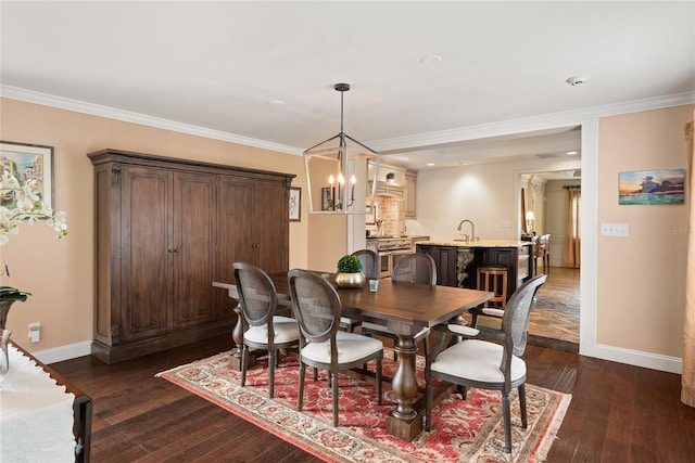 dining space featuring ornamental molding, indoor wet bar, and dark hardwood / wood-style floors