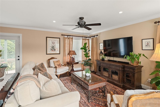 living room featuring ceiling fan, crown molding, and hardwood / wood-style floors