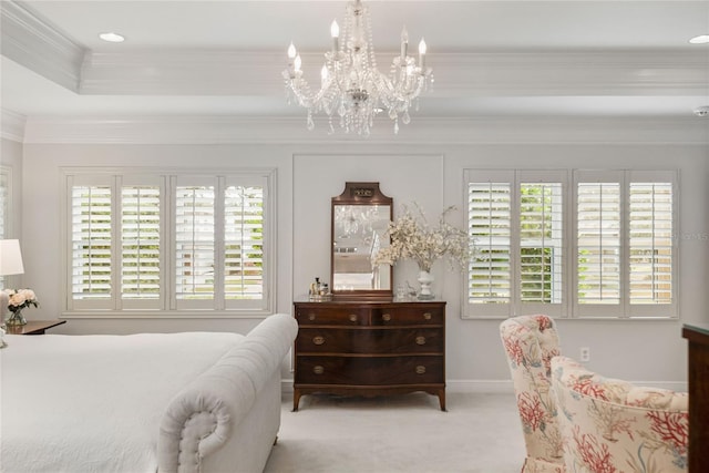 carpeted bedroom with multiple windows, ornamental molding, and an inviting chandelier