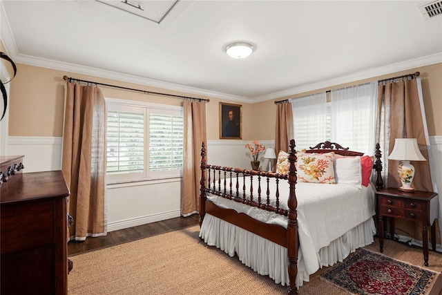 bedroom featuring dark wood-type flooring and ornamental molding