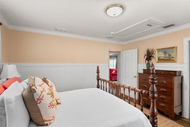 bedroom featuring crown molding and hardwood / wood-style flooring