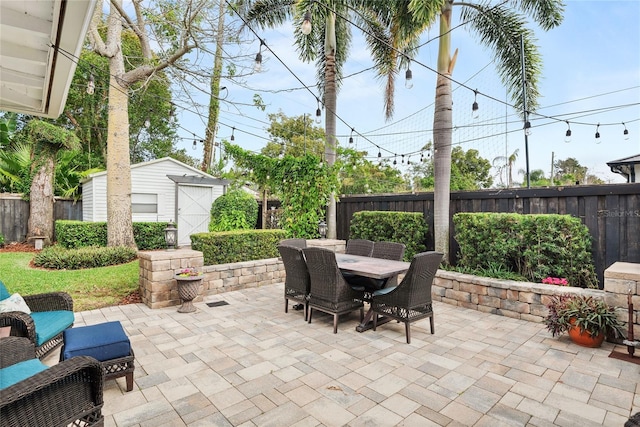 view of patio featuring a shed