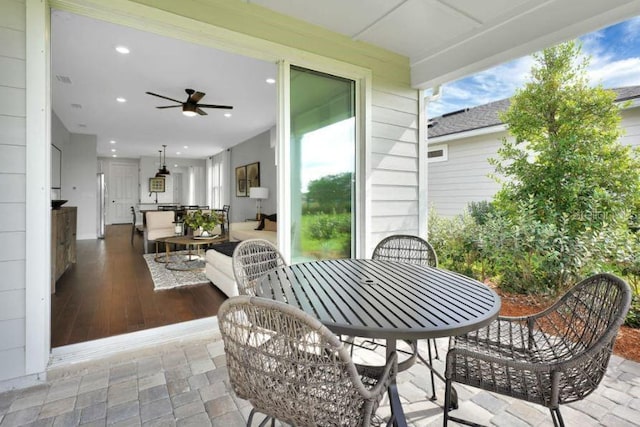 view of patio featuring ceiling fan