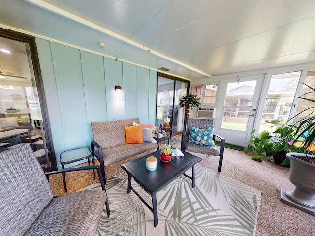 sunroom with ceiling fan and cooling unit