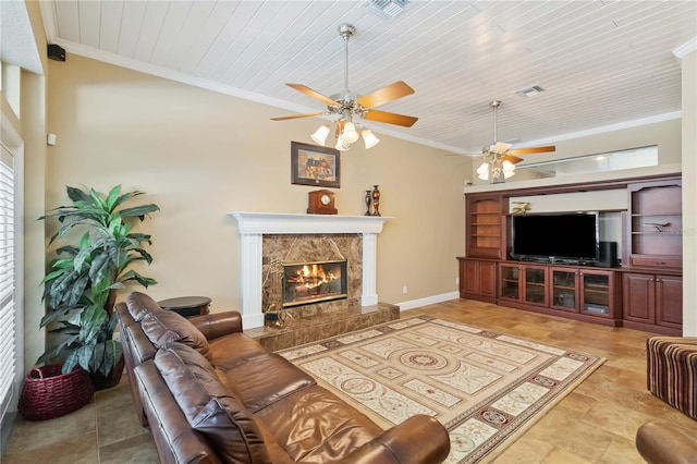 living room featuring wood ceiling, ceiling fan, ornamental molding, and a high end fireplace