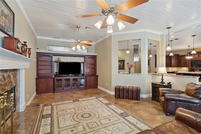 living room with a fireplace, ceiling fan, crown molding, and wood ceiling