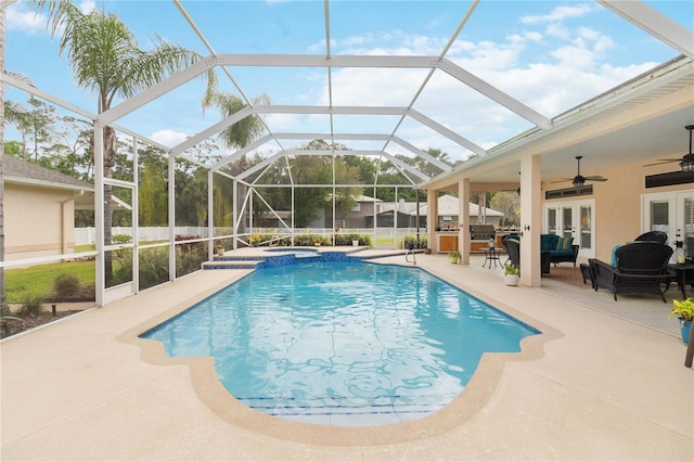 view of pool featuring french doors, area for grilling, ceiling fan, glass enclosure, and a patio