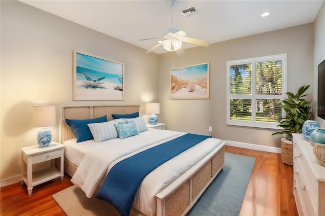 bedroom featuring ceiling fan and dark hardwood / wood-style flooring