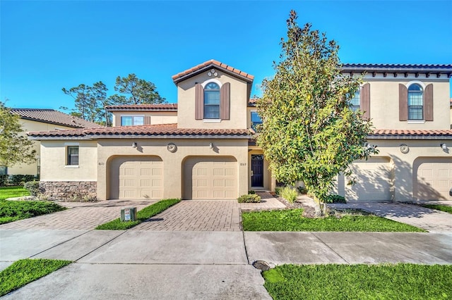 mediterranean / spanish-style house featuring a garage