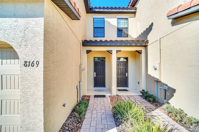 view of exterior entry featuring a garage