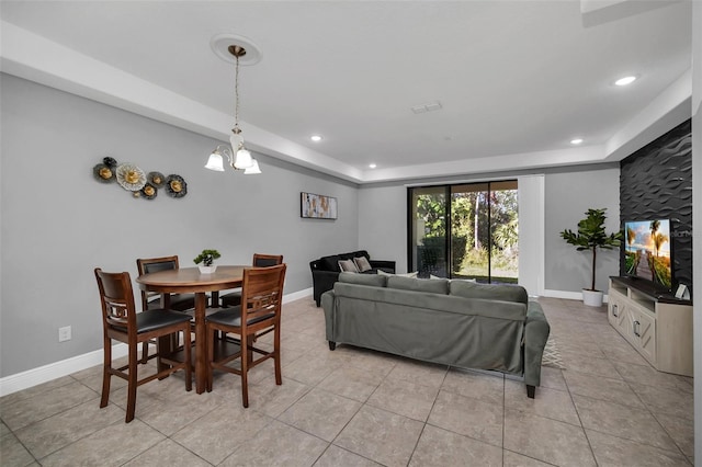 8169 Roseville Rd, Davenport, FL 33896 - living area featuring a tray ceiling, a chandelier, light tile patterned floors, and recessed lighting