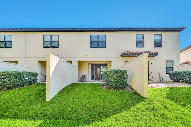 8169 Roseville Rd, Davenport, FL 33896 - back of property featuring stucco siding and a yard