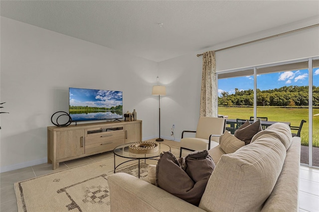 living room with light tile patterned flooring and a wealth of natural light