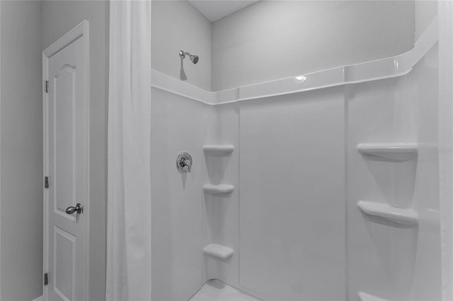 bathroom featuring walk in shower