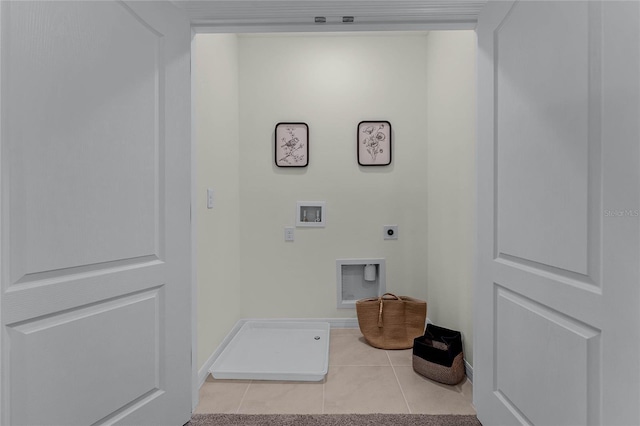 laundry area featuring hookup for an electric dryer, light tile patterned floors, and hookup for a washing machine