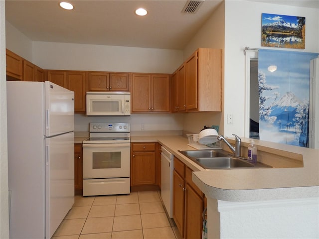 kitchen featuring kitchen peninsula, sink, light tile patterned floors, and white appliances