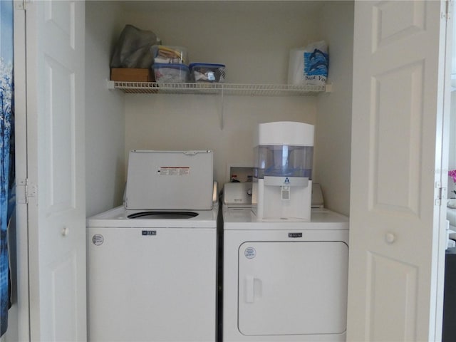 washroom featuring independent washer and dryer