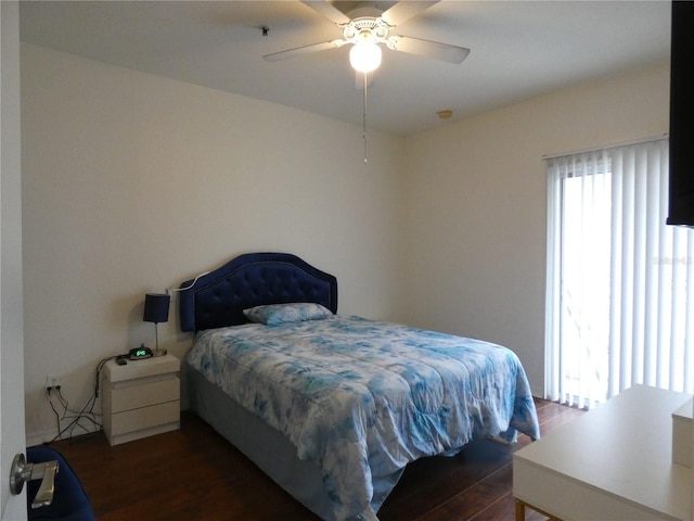 bedroom featuring ceiling fan and dark hardwood / wood-style floors