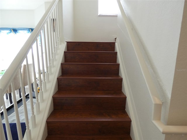 stairs featuring a wealth of natural light