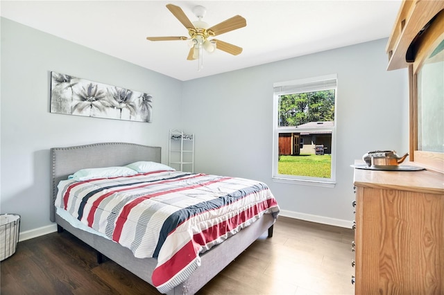 bedroom featuring ceiling fan and dark hardwood / wood-style flooring