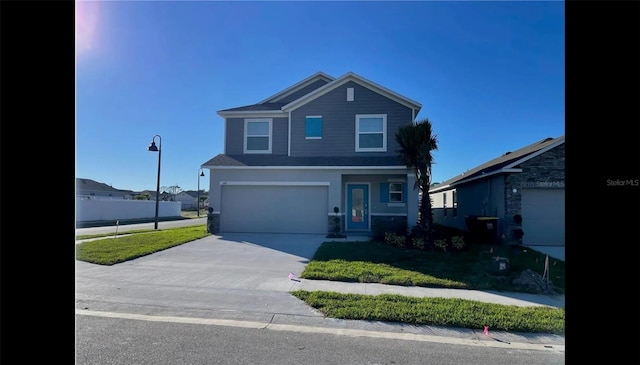 front of property with a front lawn and a garage