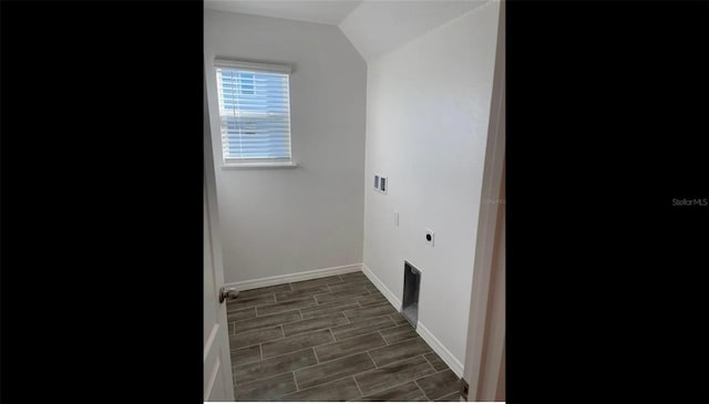 laundry area with wood tiled floor, electric dryer hookup, laundry area, and baseboards