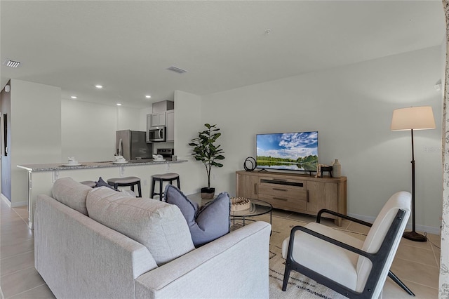 living room featuring light tile patterned floors