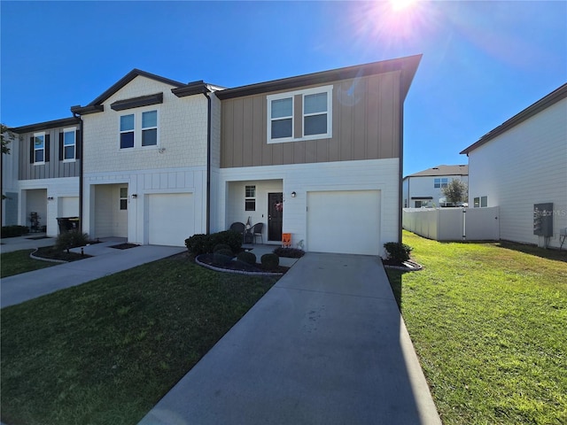 view of front of home featuring a front lawn and a garage