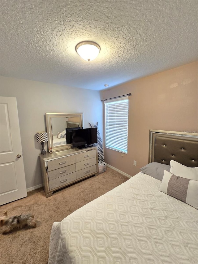 604 Madison Dr, Davenport, FL 33837 - carpeted bedroom with a textured ceiling