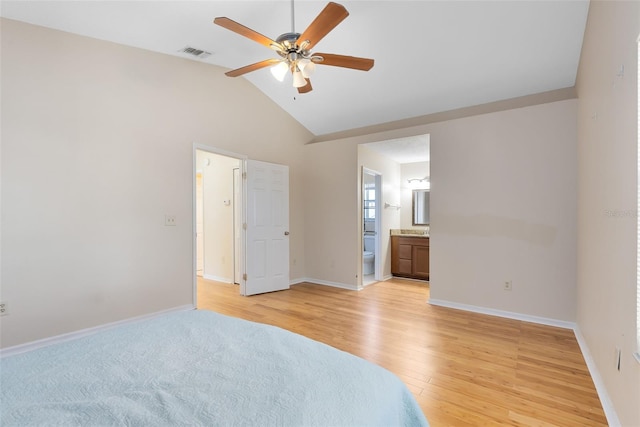 bedroom with visible vents, baseboards, and lofted ceiling