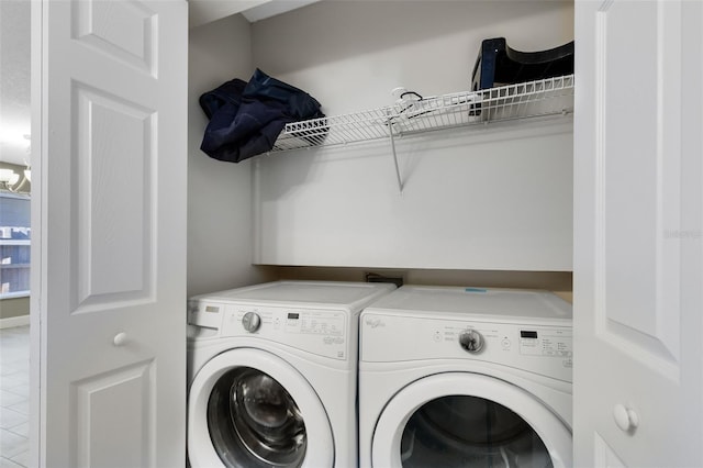 clothes washing area featuring laundry area and separate washer and dryer
